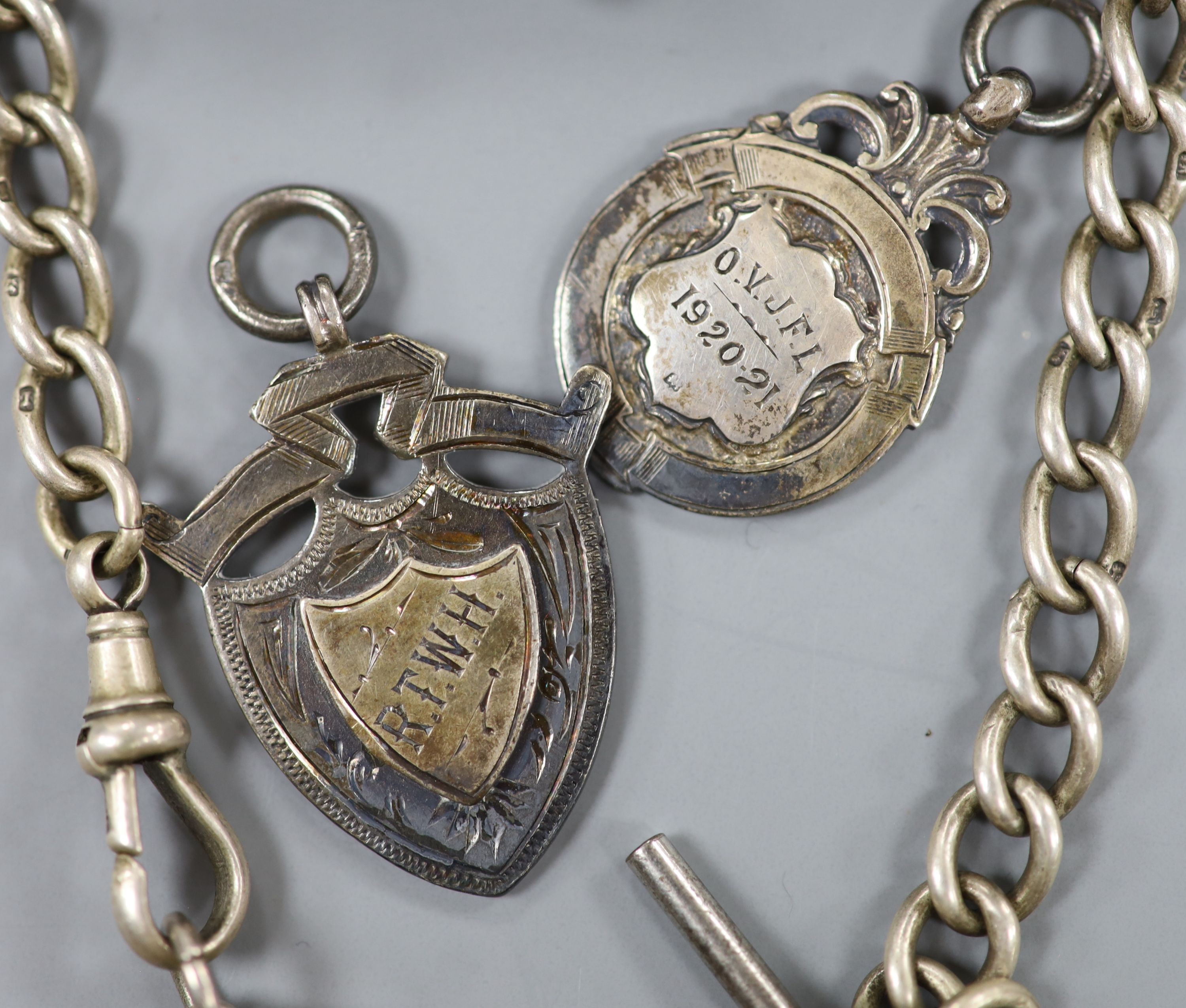 A 1940's silver cased propelling pencil, four assorted silver medallions and a silver albert.
